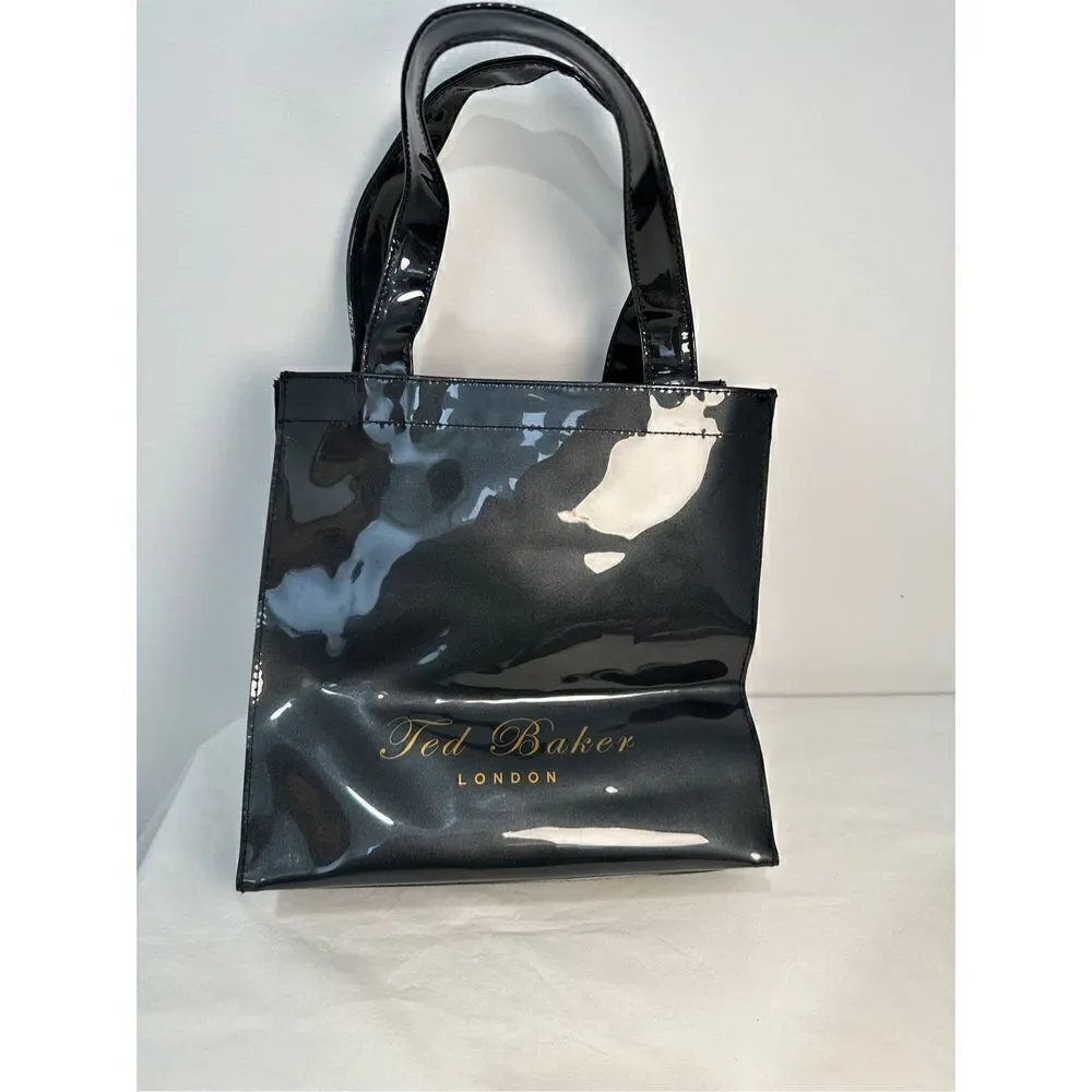 Ted Baker London Icon vinyl handbag with gold bow.    M-0927
